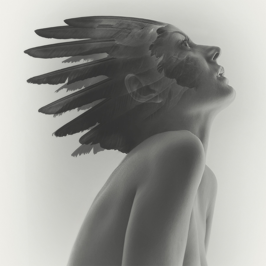 Double exposure female nude of Anna Lena with feather head dress
